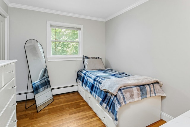 25 Macgregor Dr, Mahopac, NY 10541 - bedroom with baseboard heating, ornamental molding, light wood-style flooring, and baseboards