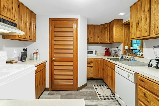 25 Macgregor Dr, Mahopac, NY 10541 - kitchen featuring white appliances, a sink, light countertops, under cabinet range hood, and light wood-style floors
