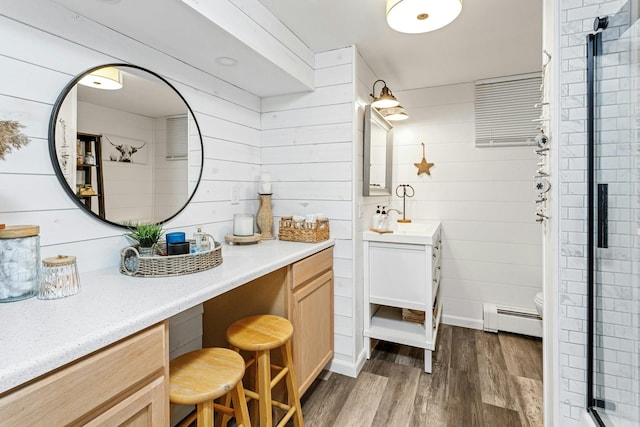 25 Macgregor Dr, Mahopac, NY 10541 - full bathroom with baseboard heating, wood finished floors, vanity, a shower stall, and wooden walls