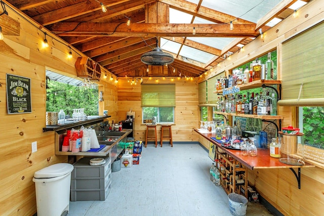 25 Macgregor Dr, Mahopac, NY 10541 - misc room featuring a workshop area, vaulted ceiling, plenty of natural light, wood walls, and a skylight