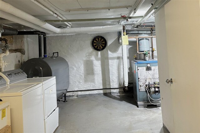 unfinished below grade area with washer and dryer and heating fuel