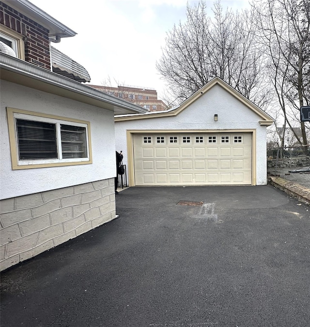 garage featuring driveway