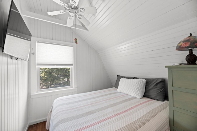110 Ocean Rd, Ocean Beach, NY 11770 - bedroom featuring lofted ceiling, a ceiling fan, wood finished floors, and wood walls