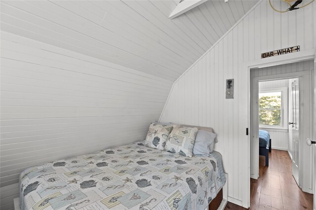 110 Ocean Rd, Ocean Beach, NY 11770 - bedroom with lofted ceiling and dark wood-style flooring