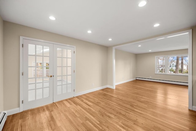 interior space featuring recessed lighting, a baseboard radiator, french doors, and light wood finished floors