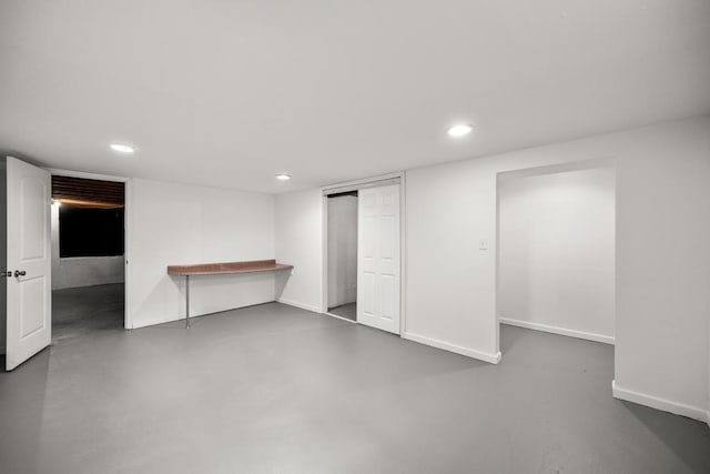 finished basement featuring recessed lighting and baseboards