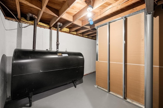 unfinished basement featuring heating fuel