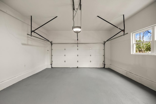 garage featuring baseboards and a garage door opener