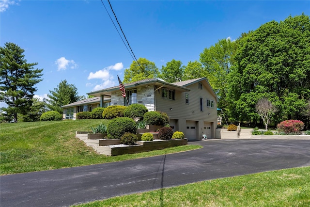 24 Top O Hill Rd, Wappingers Falls, NY 12590 - view of front of property with a garage, driveway, and a front lawn