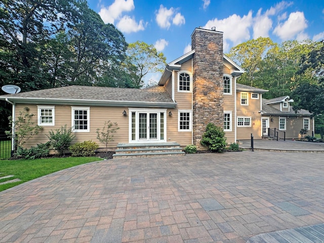 33 Bacon Rd, Saint James, NY 11780 - back of house with a chimney