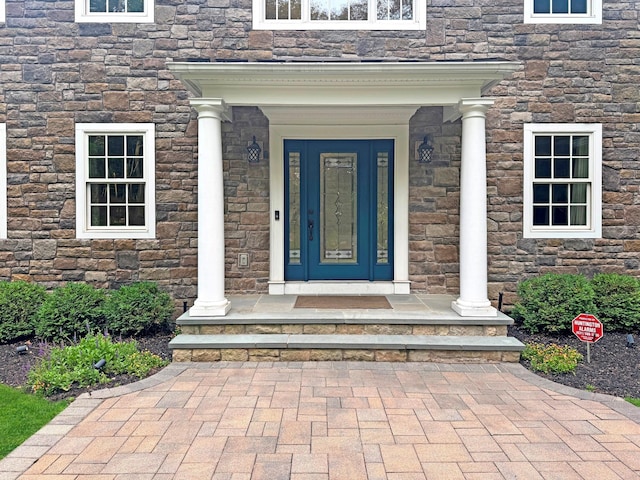 33 Bacon Rd, Saint James, NY 11780 - doorway to property featuring stone siding
