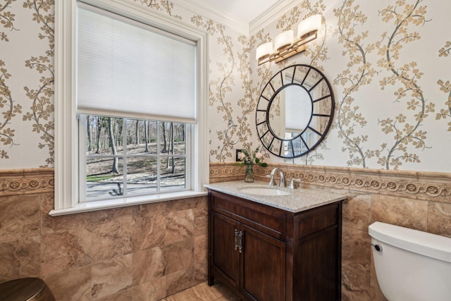 33 Bacon Rd, Saint James, NY 11780 - half bath featuring wallpapered walls, vanity, a wainscoted wall, and tile walls