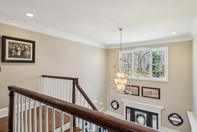 33 Bacon Rd, Saint James, NY 11780 - corridor featuring an upstairs landing, a chandelier, recessed lighting, wood finished floors, and crown molding