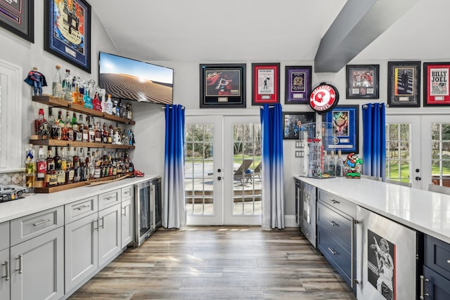 33 Bacon Rd, Saint James, NY 11780 - indoor dry bar featuring french doors, wine cooler, and wood finished floors