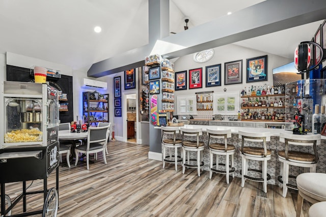 33 Bacon Rd, Saint James, NY 11780 - community bar area featuring a wall mounted AC, light wood-style floors, high vaulted ceiling, and recessed lighting