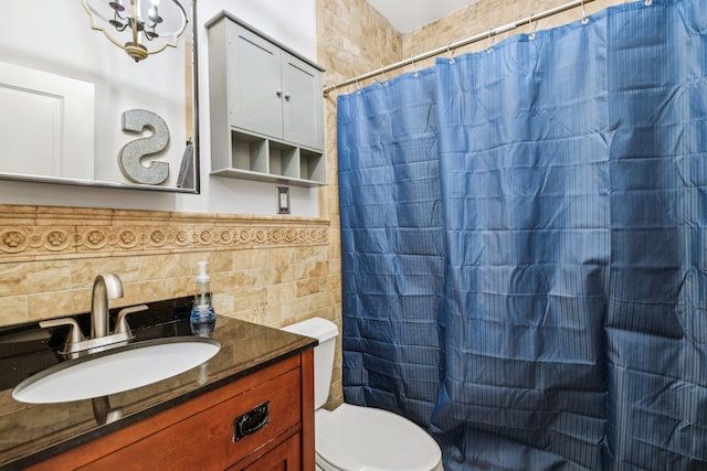 33 Bacon Rd, Saint James, NY 11780 - full bathroom with tile walls, vanity, a shower with shower curtain, and a wainscoted wall