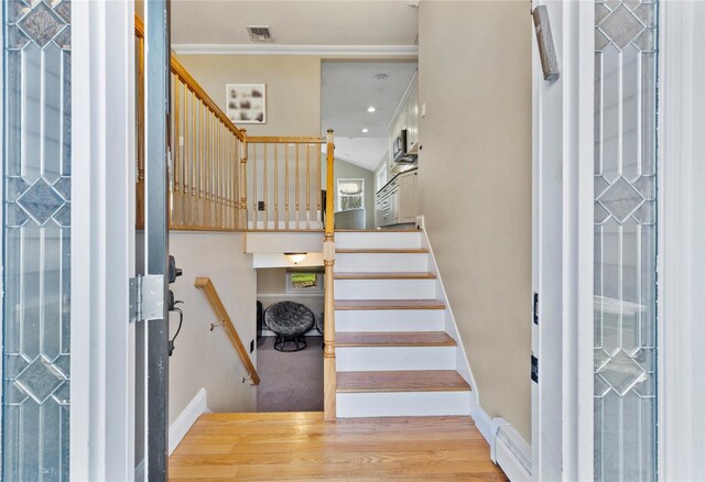 3 Bell Ct, Airmont, NY 10901 - stairway featuring wood finished floors, baseboards, and visible vents