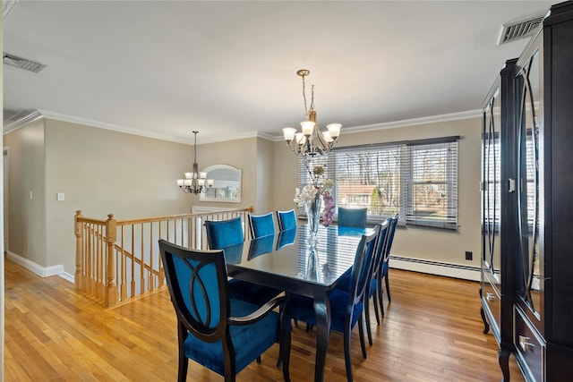 3 Bell Ct, Airmont, NY 10901 - dining room featuring a chandelier, a baseboard radiator, visible vents, and light wood-style flooring