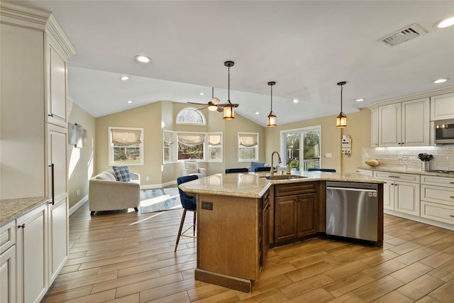3 Bell Ct, Airmont, NY 10901 - kitchen featuring visible vents, a sink, wood tiled floor, stainless steel appliances, and open floor plan