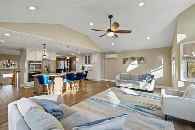 3 Bell Ct, Airmont, NY 10901 - living area with light wood-type flooring, a wall mounted air conditioner, recessed lighting, lofted ceiling, and ceiling fan