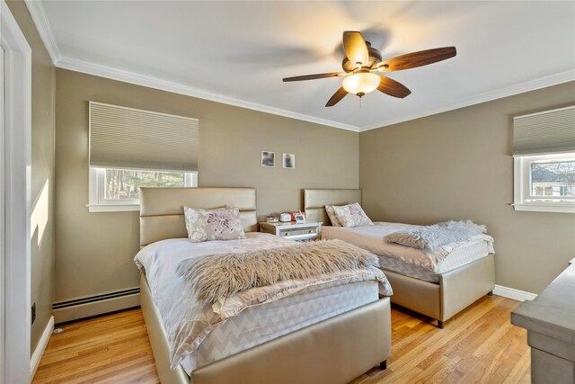 3 Bell Ct, Airmont, NY 10901 - bedroom featuring crown molding, light wood-type flooring, multiple windows, and a baseboard heating unit