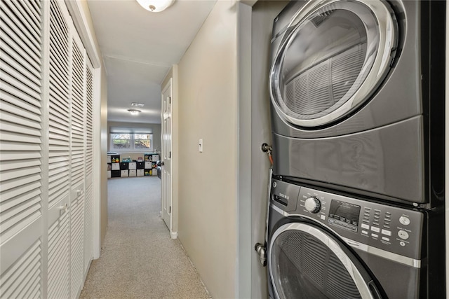3 Bell Ct, Airmont, NY 10901 - laundry area featuring stacked washer / dryer, laundry area, and carpet