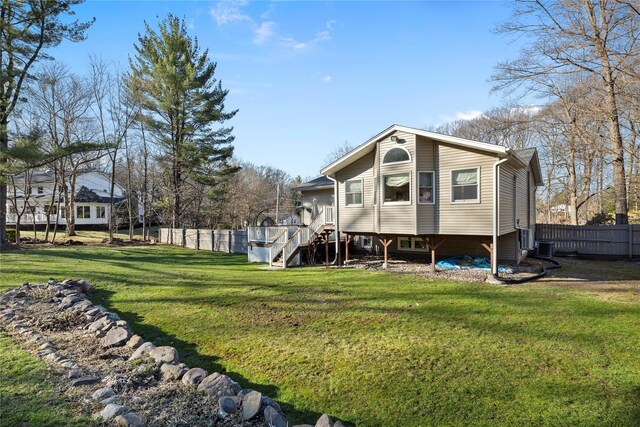 3 Bell Ct, Airmont, NY 10901 - rear view of house with fence, a lawn, and stairs