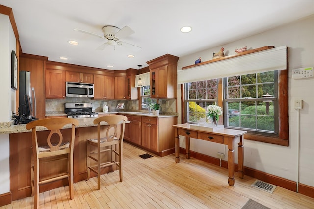 29 Oscaleta Rd, South Salem, NY 10590 - kitchen featuring a peninsula, a sink, backsplash, ceiling fan, and appliances with stainless steel finishes
