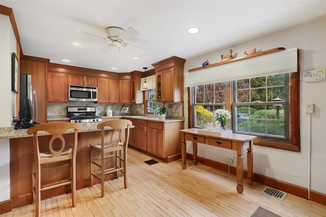 29 Oscaleta Rd, South Salem, NY 10590 - kitchen with stainless steel appliances, a peninsula, a sink, backsplash, and ceiling fan