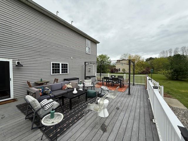 49 Macintosh Dr, Hudson, NY 12534 - wooden terrace with outdoor dining area and an outdoor hangout area