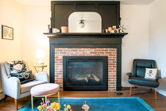 49 Macintosh Dr, Hudson, NY 12534 - detailed view of a fireplace, wood finished floors, and baseboards