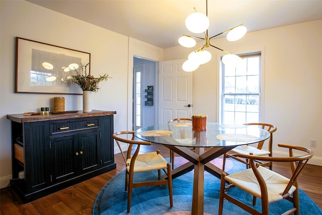 49 Macintosh Dr, Hudson, NY 12534 - dining room featuring a chandelier, dark wood-style flooring, and baseboards