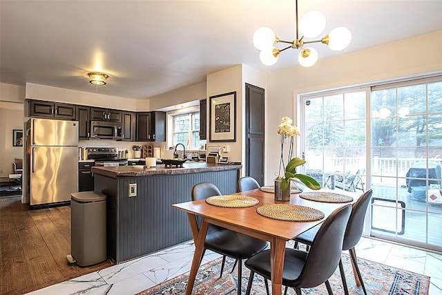 49 Macintosh Dr, Hudson, NY 12534 - dining room featuring a chandelier and marble finish floors