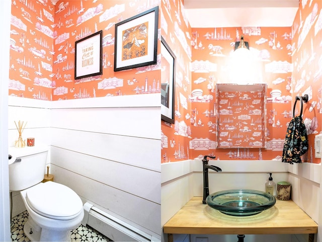 49 Macintosh Dr, Hudson, NY 12534 - half bath featuring a baseboard radiator, toilet, and a sink