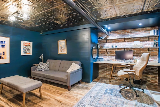 49 Macintosh Dr, Hudson, NY 12534 - office area featuring an ornate ceiling, wood finished floors, and brick wall
