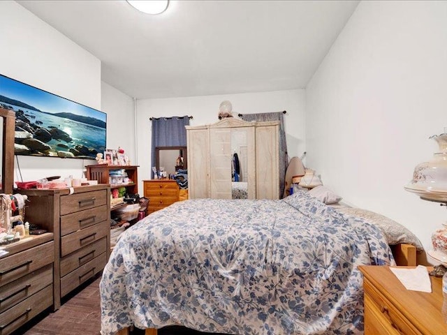 bedroom featuring wood finished floors