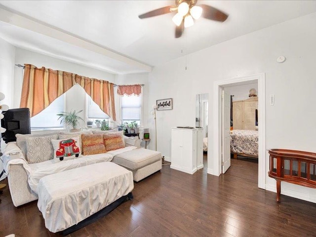 living room with baseboards, ceiling fan, and wood finished floors