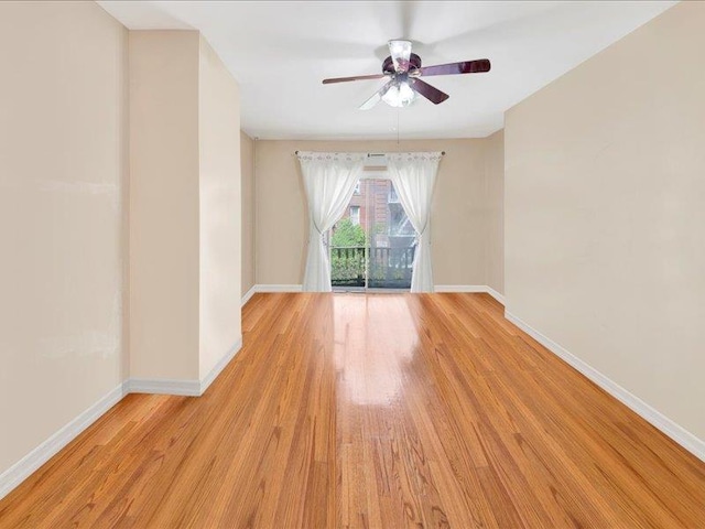 2790 Bainbridge Ave, Bronx, NY 10458 - spare room featuring baseboards and ceiling fan