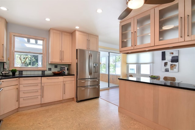 435 Carol Pl, Pelham, NY 10803 - kitchen with stainless steel fridge with ice dispenser, glass insert cabinets, a sink, light brown cabinetry, and recessed lighting