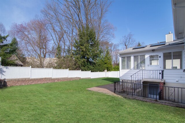 435 Carol Pl, Pelham, NY 10803 - view of yard with a fenced backyard and a sunroom