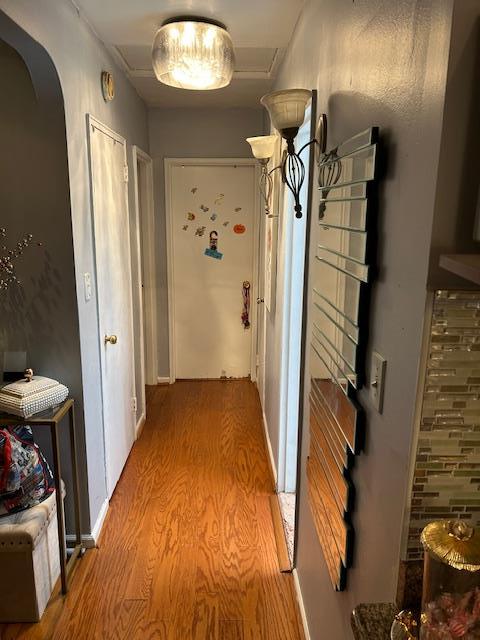 1248 E 84th St, Brooklyn, NY 11236 - hallway featuring light wood-type flooring and arched walkways