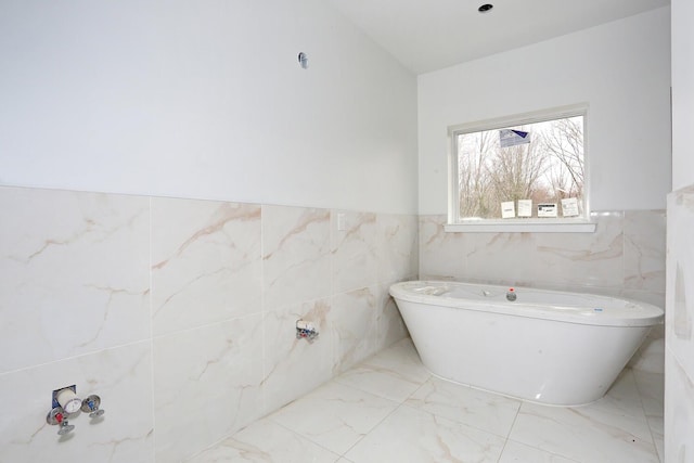 334NOhioville Rd, New Paltz, NY 12561 - full bath featuring wainscoting, a freestanding bath, marble finish floor, and tile walls