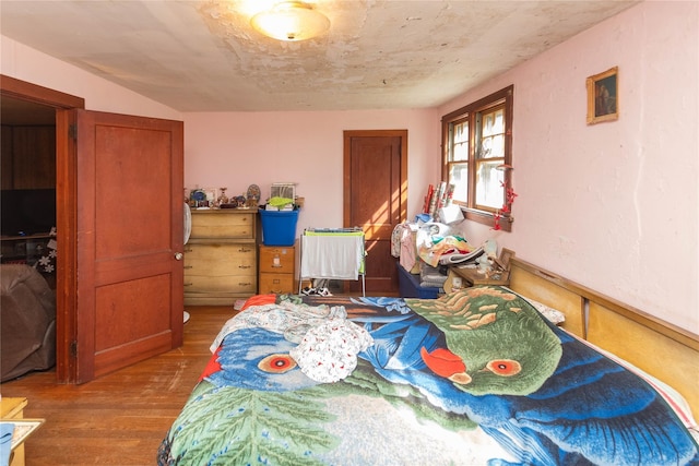 bedroom with wood finished floors