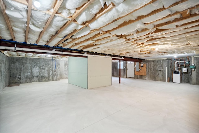 unfinished basement with water heater