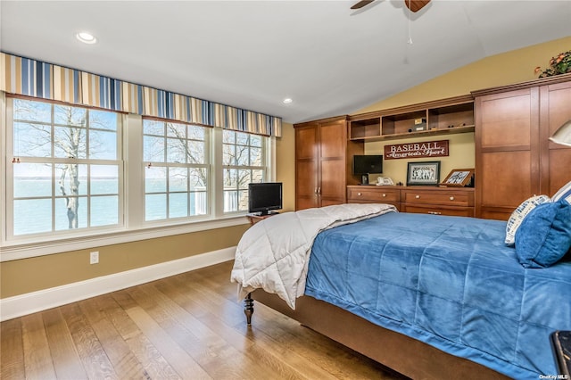 279 Little Neck Rd, Centerport, NY 11721 - bedroom featuring baseboards, vaulted ceiling, wood finished floors, and recessed lighting
