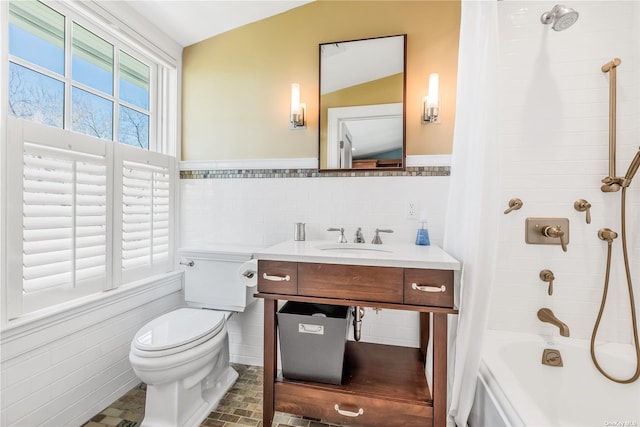 279 Little Neck Rd, Centerport, NY 11721 - full bathroom featuring shower / bathtub combination with curtain, vanity, tile walls, toilet, and wainscoting