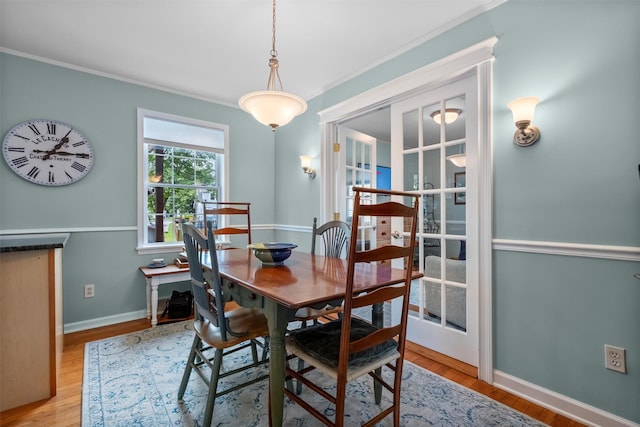 7 Wilson Blvd, Poughkeepsie, NY 12603 - dining space featuring ornamental molding, french doors, baseboards, and light wood-style flooring