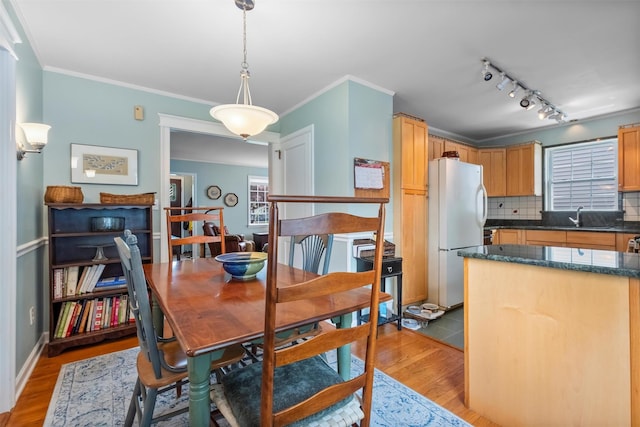 7 Wilson Blvd, Poughkeepsie, NY 12603 - dining space with light wood-type flooring, ornamental molding, and rail lighting