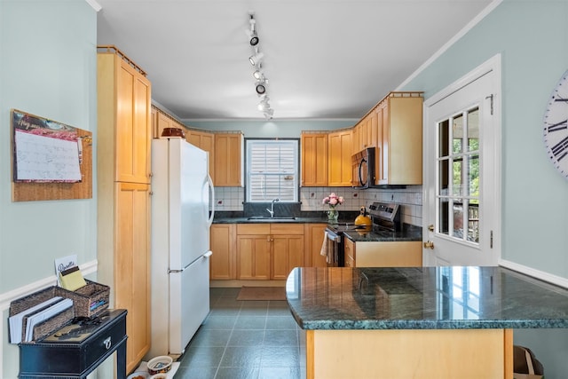 7 Wilson Blvd, Poughkeepsie, NY 12603 - kitchen featuring stainless steel range with electric stovetop, freestanding refrigerator, black microwave, decorative backsplash, and a sink
