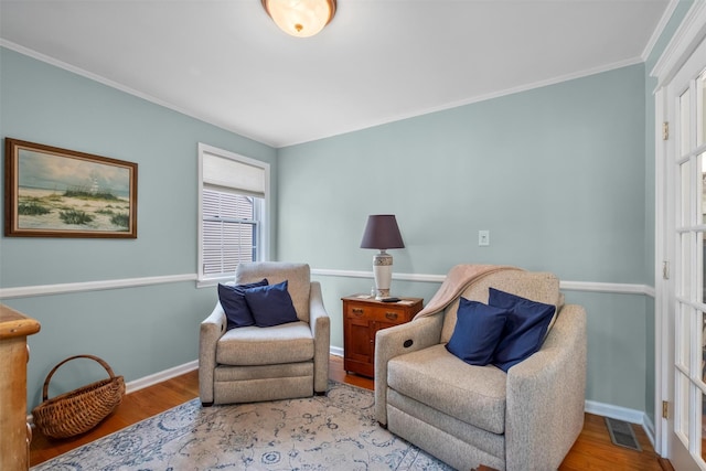 7 Wilson Blvd, Poughkeepsie, NY 12603 - sitting room with wood finished floors, baseboards, and crown molding